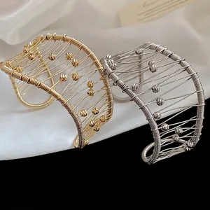 Metallic woven hollow mesh open cuff bracelet in gold and silver plating with wave design