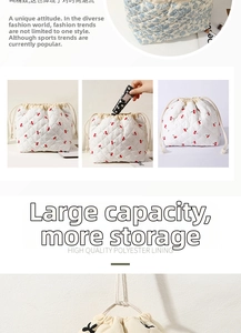 Quilted cosmetic pouch with cherry and floral prints, drawstring closure, large capacity travel storage bag.