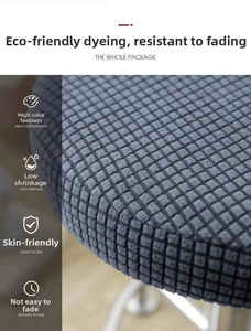 Detail of grey waffle textured fabric chair cover showing high elasticity and breathable weave