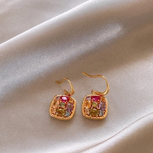 Detail of 18k gold plated earring hook with square multi-color gemstone pendants