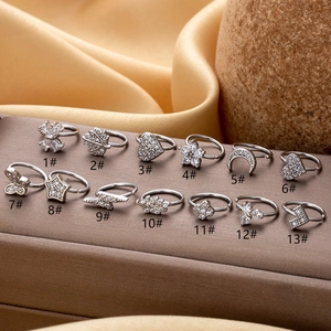 Collection of silver copper nose rings with zircon in heart, flower, and butterfly shapes