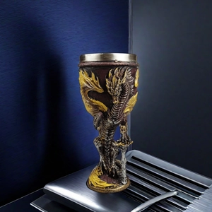 Close-up of golden dragon wine goblet with intricate resin carving and metal rim