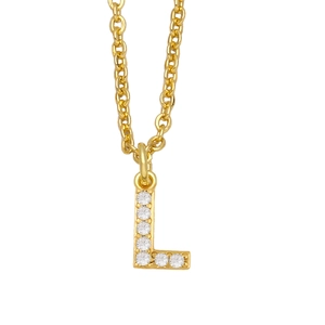 Macro shot of gold-plated capital letter L pendant necklace with cubic zirconia inlay