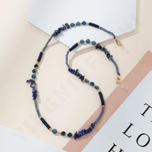 Detail of blue lapis lazuli beaded eyewear chain with gold lobster clasps and rubber loops