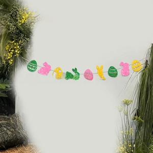 Detail of glitter bunny and egg banners for Easter decoration in pink green and yellow