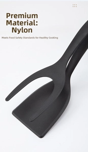 Close-up of heat-resistant black nylon 2-in-1 kitchen spatula and food tongs tool
