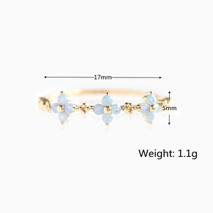 18K gold ring with blue flower zircon petals measuring 17mm width and weighing 1.1g