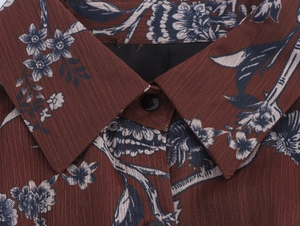Close-up of floral print chiffon shirt with lapel collar and dark button detail