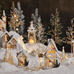 Lighted wooden Christmas house set with miniature trees and warm LED holiday decor