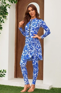 Detailed view of long-sleeve floral surfing suit featuring a front zipper and side-tie skirt