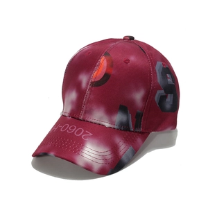 Detail of trendy dark red baseball cap featuring graffiti prints and 2060-H text