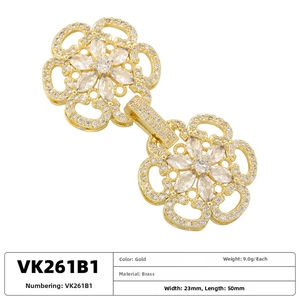 Macro view of gold-plated brass floral necklace clasp set with marquise cubic zirconia