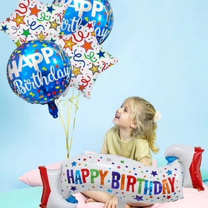 Kids birthday party decoration set with foil balloons and happy birthday banner display