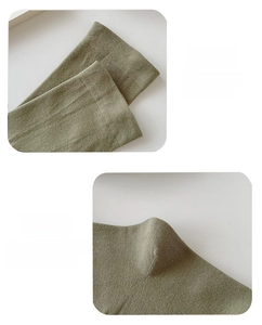 Detail of army green cotton socks showing elastic cuffs and 3D heel construction