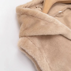Women's autumn beige fleece hooded vest featuring knot buckle detail on a wooden hanger