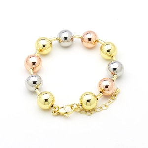 Detail view of tri-color polished metal beads on an adjustable 18k gold plated bracelet