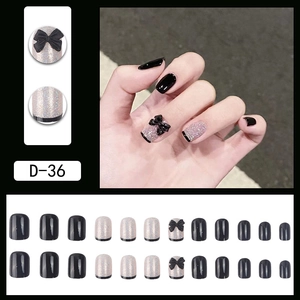 Faux ongles noirs scintillants avec paillettes argentées, nœuds 3D et pointes French