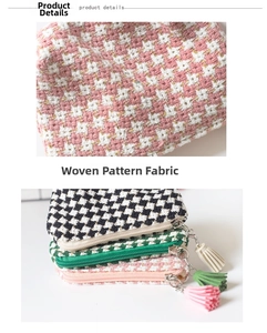 Detail of woven plaid fabric texture and tassel charms on mini coin purses