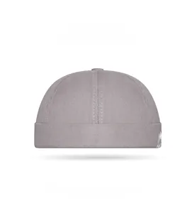 Detailed embroidery of mountain peak and letters on dark gray cotton docker cap