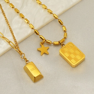 Polished gold stainless steel zodiac necklace set with star and gold bar pendants