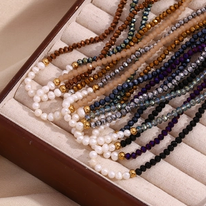 Detail of freshwater pearl necklaces with colored crystal beads in a jewelry box