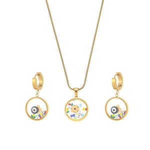 Gold evil eye jewelry set with pendant necklace and hoop earrings in vintage style