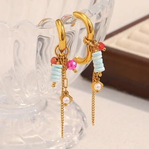 Detail view of 18K gold plated hoop earrings with pink, red, blue beads and pearls
