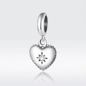 S925 sterling silver heart charm with sparkling starburst zircon and beaded edging