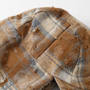 Retro brown checkered trapper hat for boys with distressed edges and warm fleece lining
