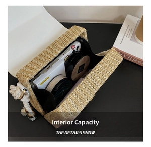 Internal view of straw woven crossbody bag showing capacity for phone and cosmetics