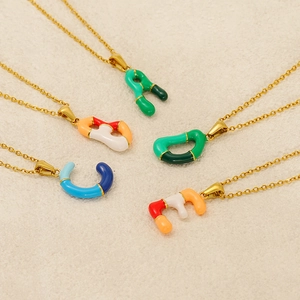 Colorful drip oil alphabet pendants on gold chains featuring 26 letters for women