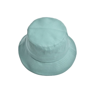 Detail of mint green bucket hat showing reinforced five-row stitching on the brim