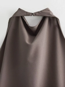 Detail of dark brown halter neckline with premium woven fabric texture and stitching