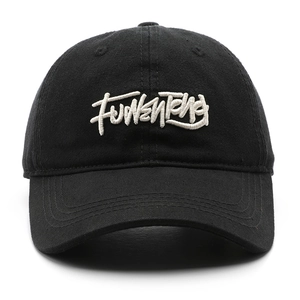 Classic black cotton baseball cap with white graffiti embroidery in a street style look