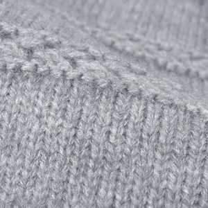 Thick light gray knitted beanie with fleece lining for warm autumn and winter outdoor wear