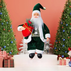 Close-up of green velvet standing Santa Claus with lantern and gift bag detail