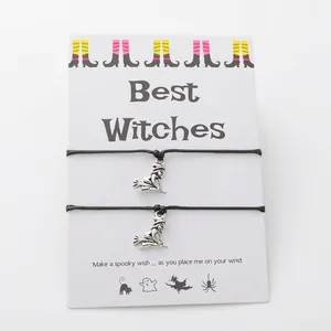 Detail of Halloween Best Witches card set with two witch broom charm cord bracelets