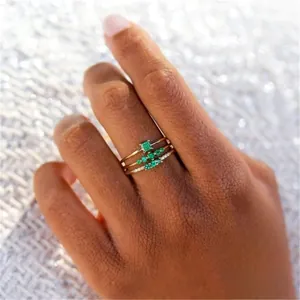 Three-piece stackable 925 sterling silver ring set with emerald green zircon gemstones