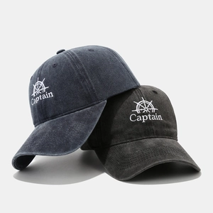 Vintage washed cotton baseball cap featuring Captain embroidery and nautical helm design