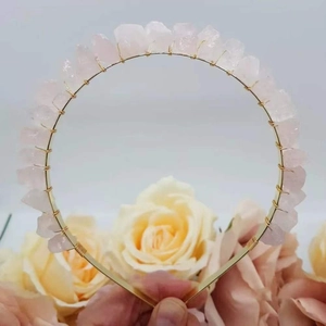 Detail of pink natural crystal crown headband with golden wire wrap craftsmanship