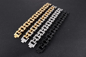 Detail of 22mm stainless steel motorcycle chain bracelets in gold, silver and black finishes