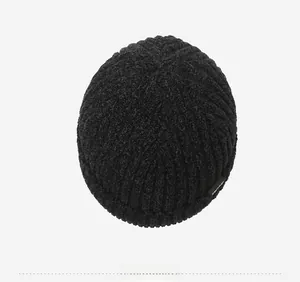 Detailed top view of a black ribbed knit beanie featuring thick chenille warmth texture