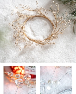 Macro detail of beaded holiday wreath with crystal beads and pearls on faux snow