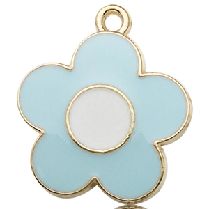 Macro shot of light blue enamel daisy charm with golden metal edges on white background