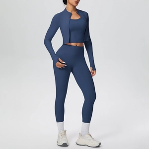 Detailed view of 3-piece navy yoga set with cropped zip jacket and high-waisted leggings