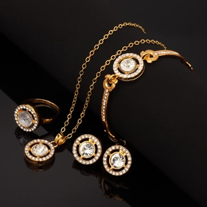 Elegant gold jewelry set with round crystals including necklace, bracelet, ring and earrings