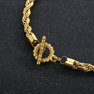 Golden titanium steel twist rope bracelet featuring a stylish OT clasp design