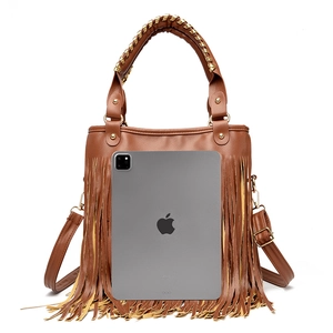 Detailed view of brown tassel bag with gold braided handles and large capacity storage