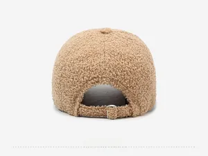 Detail view of the back of a beige teddy fleece baseball cap with adjustable metal buckle