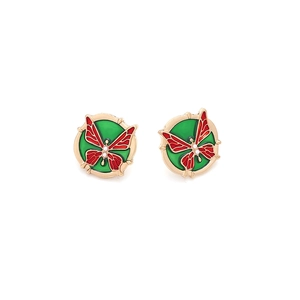 Detailed view of red butterfly earrings with green enamel and gold finish settings